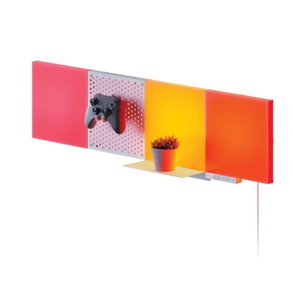 Nanoleaf display with three tiles, one pegboard, and a shelf in pink, yellow, and orange.