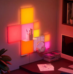 Nano light panels in a room setting with desk and computer.