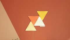 Nanoleaf triangle lights mounted on a wall