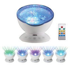Remote control and different colours lit up in the Ocean Wave Projector with Sound & Speaker projecting calming colour-changing ocean wave effects with integrated audio playback for sensory rooms, therapy clinics, classrooms, aged care, home care and NDIS environments.