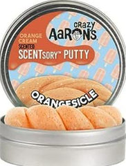 This is an image of Crazy Aarons Scentsory Putty. It is Orange and is says Orangesicle scented