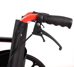 This is an image the handlebars and brakes of a Red and Black Heavy Duty Steel Wheelchair. PA280