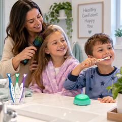 Family using a sensory Personal Grooming Set for hair brushing and tooth brushing in a home bathroom.