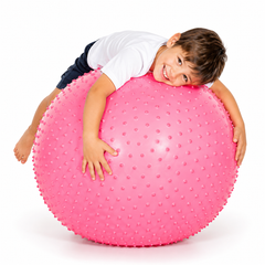 Child lying over pink Swiss Spike Ball during a balance, coordination and movement activity