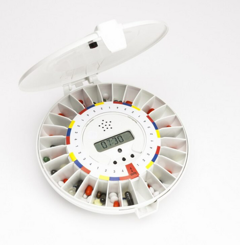 This is an image of the Pivotell Careousel Automatic Pill Dispenser opened to show the pills and timer.