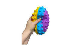 Hand holding a multi coloured pop it ball