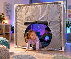 Children enjoying a Pop Up Space Tent with calming sensory lighting in a sensory room.