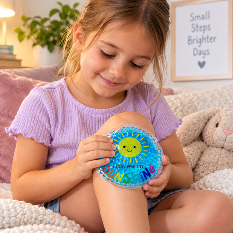 Child using a Pouchies cooling gel pack for soothing sensory comfort at home.