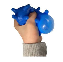 Child's hand holding blue puffer stress ball