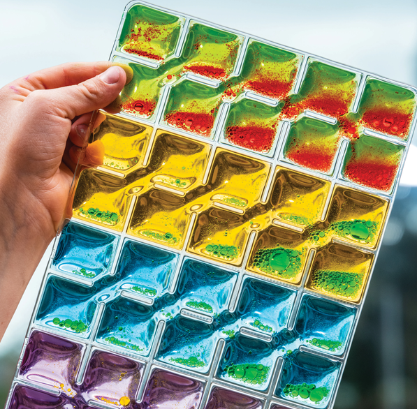 Close up of Rainbow Squares Sensory Pad set of 4 colourful visual sensory fidget pads for calming play, visual tracking, tactile exploration and sensory regulation