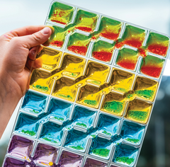 Close up of Rainbow Squares Sensory Pad set of 4 colourful visual sensory fidget pads for calming play, visual tracking, tactile exploration and sensory regulation