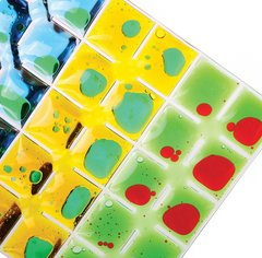 Closer look at the Rainbow Squares Sensory Pads set of 4 colourful visual sensory fidget pads with colours blue, yellow, and green with contrasting blobs inside.
