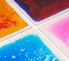 Close up of the Elizabeth Richards Sensory Liquid Floor Tiles used in a sensory room for interactive sensory play and calming movement activities