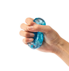 Blue Snowflake Jelly Cube being squeezed for sensory engagement