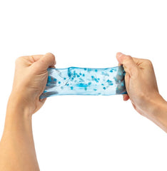 Blue Snowflake Jelly Cube stretched between hands for tactile play