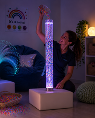 Adult filling bubble tube with plastic beads