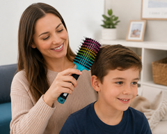 Mum gently brushing her son’s hair with a sensory hairbrush at home.