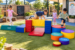 Children enjoying the Sensory Zone Balance Kit in a colourful preschool playground.
