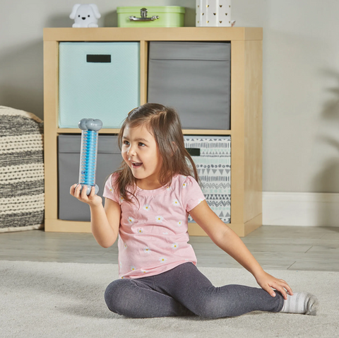 Child using Sounds of Rain Sensory Tubes during a quiet sensory break