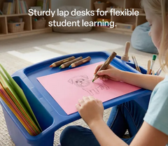 Child sitting at a blue stackable student lap desk drawing a picture.
