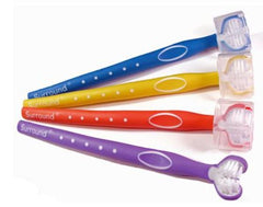 Four Surround Toothbrushes with triple brush design. Handle colours are blue, yellow, orange, and purple