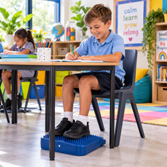 Tactile Foot Support Wedge helping a student stay focused and regulated during classroom