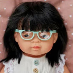 Toddler baby doll with glasses close up of head and bust