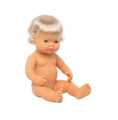 Toddler baby girl doll with hearing implant sitting up naked