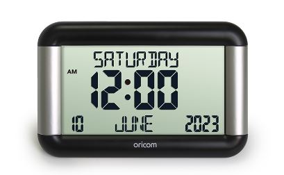 LCD digital clock showing time, date, and day