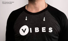 This an image of a person wearing the lanyard for the Vibes Hi-Fidelity Reusable Noise Reduction Ear Buds.