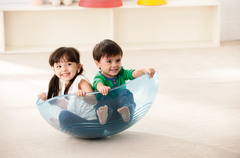 WePlay Rocking Bowl supporting active movement and balance play for two children