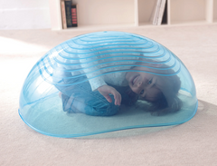 Child exploring underneath WePlay Rocking Bowl as a calming and imaginative movement space