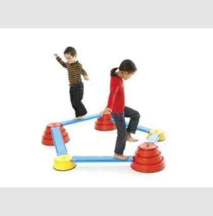 This is an image of 2 children using the Tactile Walkboards. The Walkboards are suspended on large red balance discs and small yellow balance discs.