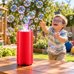 image of child chasing bubbles from a red bubble machine