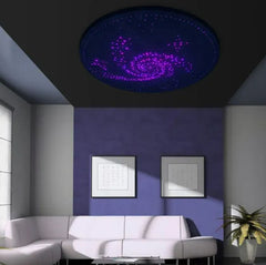 This is an image of a fibre optic Ceiling Display 1.2m+ Adaptor in a lou8nge room setting. Light colour is bright pink.