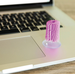 Sensory Flick Sticks attached to a laptop surface for quiet tactile fidgeting