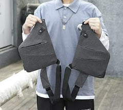 This is an image of a person holding up 2 Ergonomic Crossbody Bags.