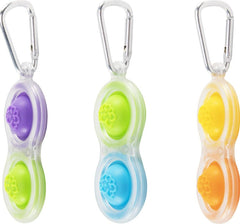Side view of the Simpl Dimpl Pop It Key Chain with integrated key clip