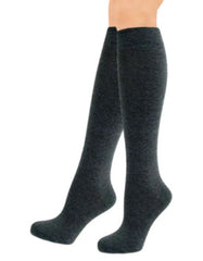 Child's legs wearing grey  calmcare knee high sensory socks 