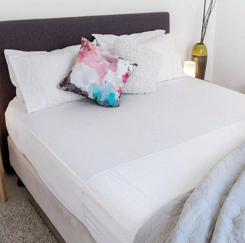 Image of a White Bed Pad with Tuck-ins.