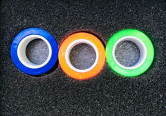 This is an image of 3 Magnetic Fidget Rings . They are blue, orange and green.