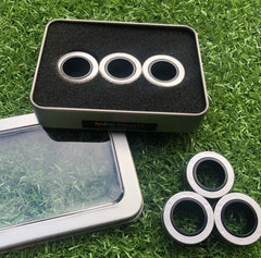 This is an image of 3 silver Magnetic Fidget Rings in a window tin.