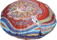 This is an image of a round cushion with an  Indigenous art design on them.