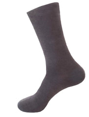 This is an image of a child wearing the Calmcare Adaptive Ankle Length Sensory Socks - grey