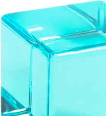 Close-up of a translucent blue acrylic gem cube.