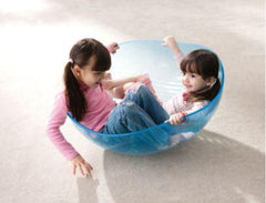 This is an image of a clear rocking bowl for children to play and rock in.
