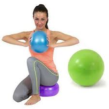 This is an image of a lady using rubber Chi Balls to help her with Yoga. The colours are light green,  purple and blue