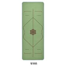 This is an image of a green Yoga fitness Mat with alignment lines to assist with foot placement