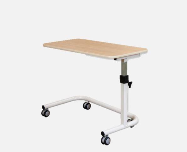 this is an image of an overbed table with gas lift. It has a wood look beige top